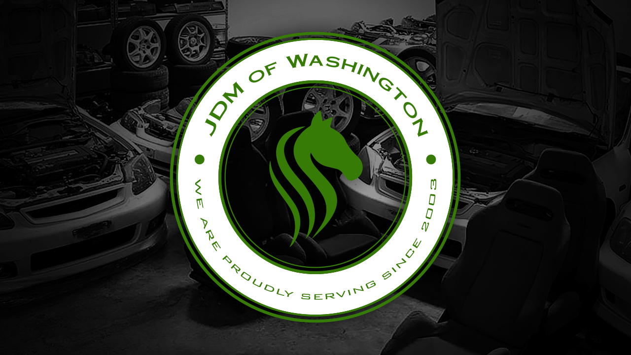 JDM of Washington's logo, logo seal over a photo of an automotive shop